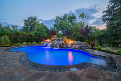 Mid-sized brick and custom-shaped pool photo in New York