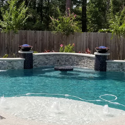 Inspiration for a contemporary custom-shaped pool remodel in Houston with decking