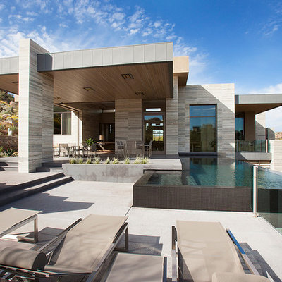 Inspiration for a huge modern backyard rectangular and concrete infinity pool remodel in Phoenix