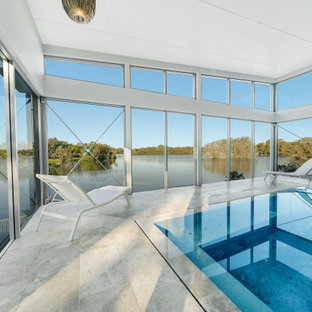 Photo of a contemporary indoor rectangular pool in Gold Coast - Tweed with tile.