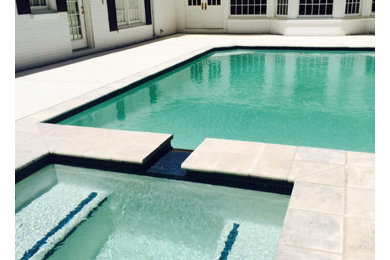 Hot tub - large modern backyard tile and rectangular hot tub idea in Dallas