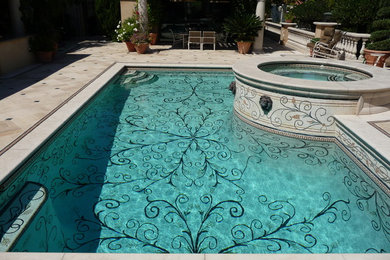 Example of a mid-sized eclectic backyard tile and rectangular pool fountain design in Orange County