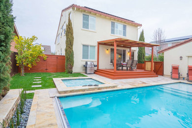 Hot tub - mid-sized traditional backyard stone and rectangular lap hot tub idea in San Francisco