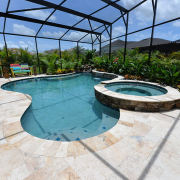 Pool and spa with Rock Water Features in Davenport, Florida