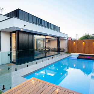Design ideas for a contemporary backyard rectangular lap pool in Adelaide with a hot tub and decking.