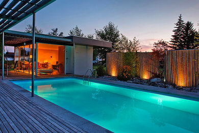 Contemporary swimming pool in Other.
