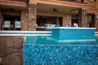 Mid-sized trendy backyard infinity pool photo in Hawaii
