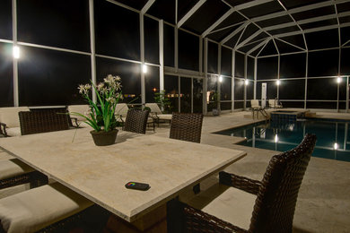 Example of a trendy backyard pool design in Miami
