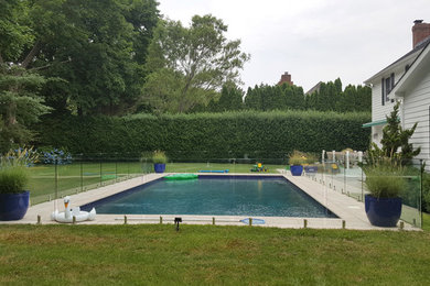 Minimalist backyard rectangular aboveground pool photo in New York