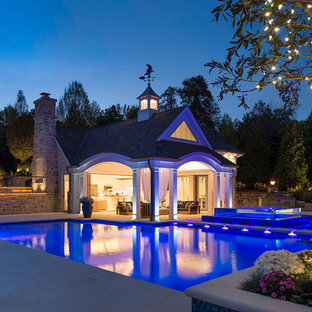 Pool house - mediterranean backyard concrete and rectangular pool house idea in Cleveland