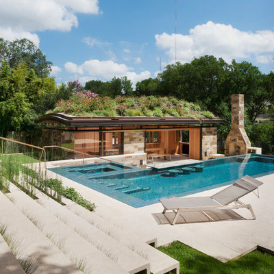 Inspiration for a contemporary backyard l-shaped pool house remodel in Austin