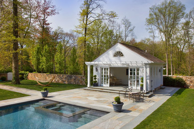 Example of a classic rectangular pool house design in New York