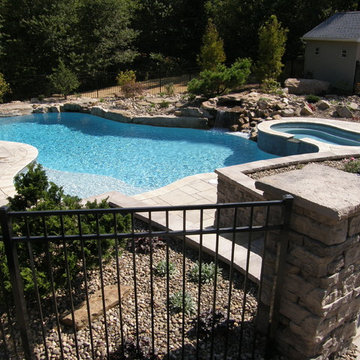 Pool oasis with stream and waterfall