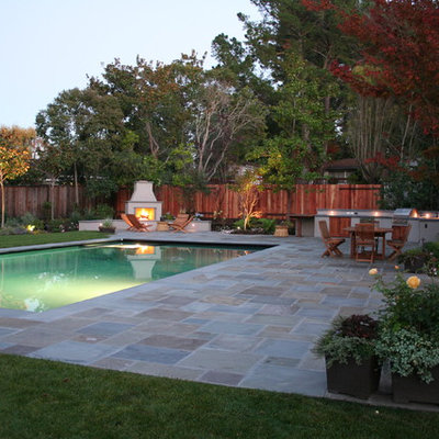 Example of a large classic backyard rectangular and stone lap pool design in San Francisco