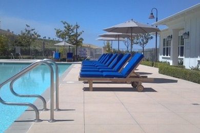 Pool house - mid-sized backyard tile and rectangular pool house idea in San Diego