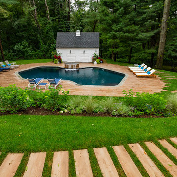 Pool Renovation with Water Features and Porcelain Tile Deck