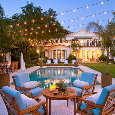 Elegant backyard rectangular and concrete paver pool photo in Orlando