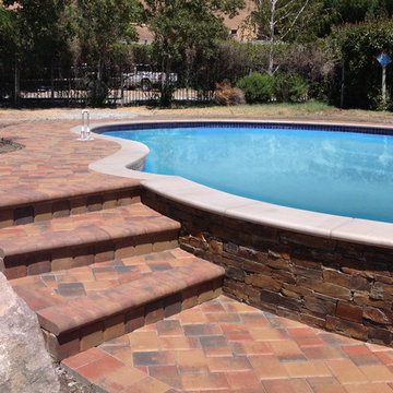 Pool with Copper Loose Stone Veneer and Pavers