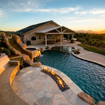 Pool with slide, water fall and fire feature!