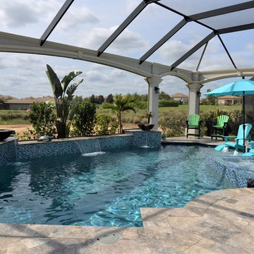 Pool with Spa, Sun Shelf, and Water Features Davenport