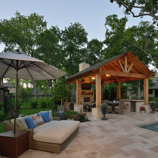 Large elegant backyard stone and rectangular lap pool house photo in Dallas