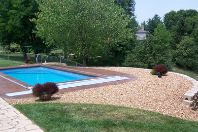 Small backyard concrete and rectangular natural pool photo in Cincinnati