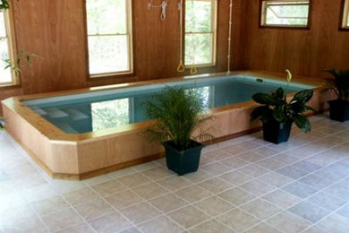 Large indoor custom-shaped pool photo in Other