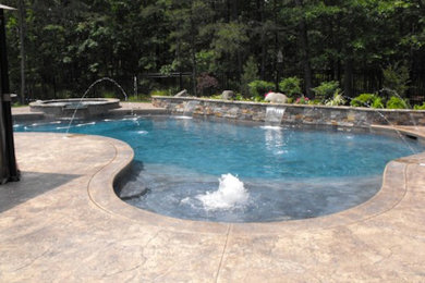 Photo of a back custom shaped swimming pool in Philadelphia.