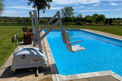 Design ideas for a medium sized contemporary swimming pool in Surrey.