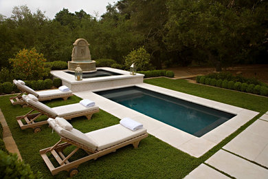 Example of a small trendy stone and rectangular pool fountain design in Santa Barbara