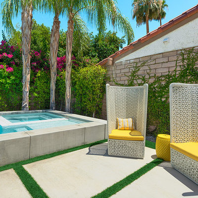 Pool fountain - small mid-century modern backyard concrete and rectangular pool fountain idea in Los Angeles