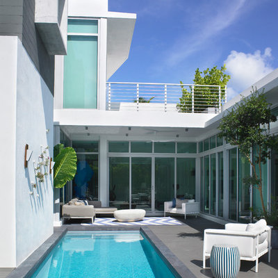 Trendy courtyard lap pool photo in Miami