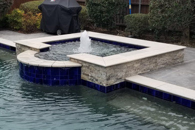 Pool house - large tropical backyard concrete paver and custom-shaped aboveground pool house idea in Dallas