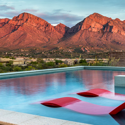 Mid-sized southwest backyard tile and rectangular aboveground hot tub photo in Phoenix