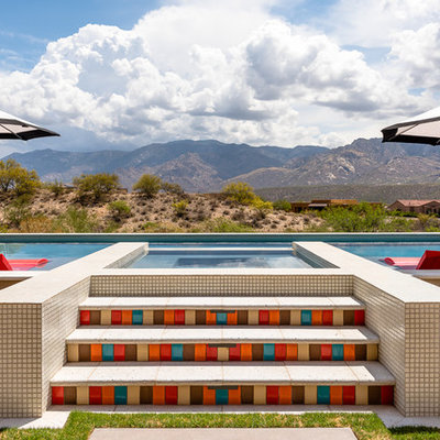 Hot tub - mid-sized southwestern backyard tile and rectangular aboveground hot tub idea in Phoenix