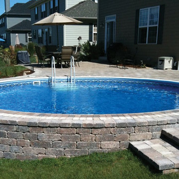 Radiant Round Semi In Ground Pool with Pavers