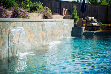 Inspiration for a mid-sized timeless backyard rectangular lap pool fountain remodel in Sacramento with decking