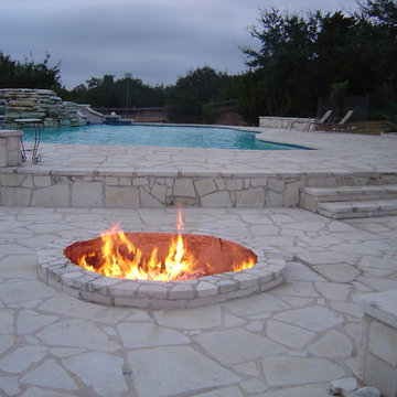 Ranch Home Freeform Pool with Limestone Deck and Fire Pit by Cliff Bechtold