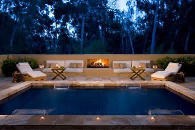 Medium sized contemporary back rectangular lengths swimming pool in San Diego with a water feature and tiled flooring.