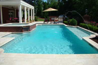 Inspiration for a timeless backyard rectangular pool fountain remodel in Atlanta
