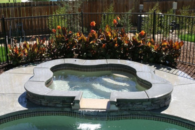 Hot tub - backyard stamped concrete hot tub idea in Other