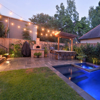 Inspiration for a mid-sized timeless backyard stone and rectangular natural hot tub remodel in New Orleans