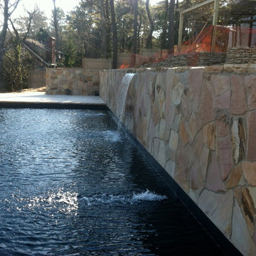 retaining wall masonry with sheer descent waterfall pool patricks pools builder