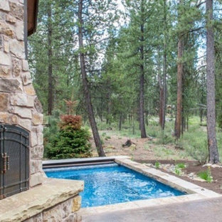 Photo of a small country backyard rectangular lap pool in Portland with concrete slab.