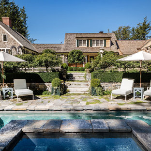 Cottage chic pool photo in New York