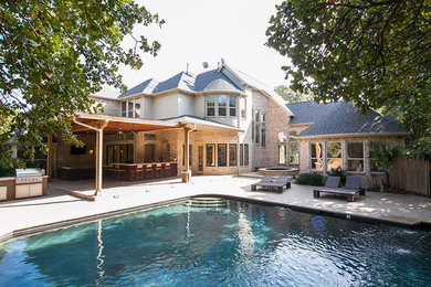 Inspiration for a large contemporary backyard concrete and custom-shaped natural pool fountain remodel in Dallas