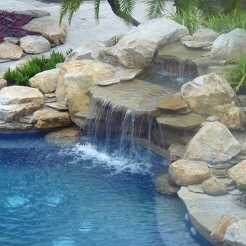 Rock waterfall and pond into swimming pool