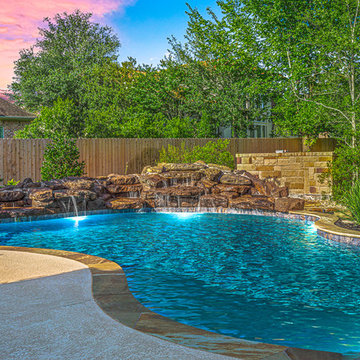 Rock Waterfall on Freeform Pool with Flagstone Coping