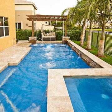 Roman/Geometric Pool With Pergola, Laminar Deck Jets and Spa in Boynton Beach