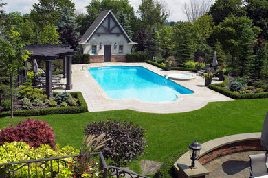 Pool fountain - large contemporary backyard custom-shaped natural pool fountain idea in Toronto